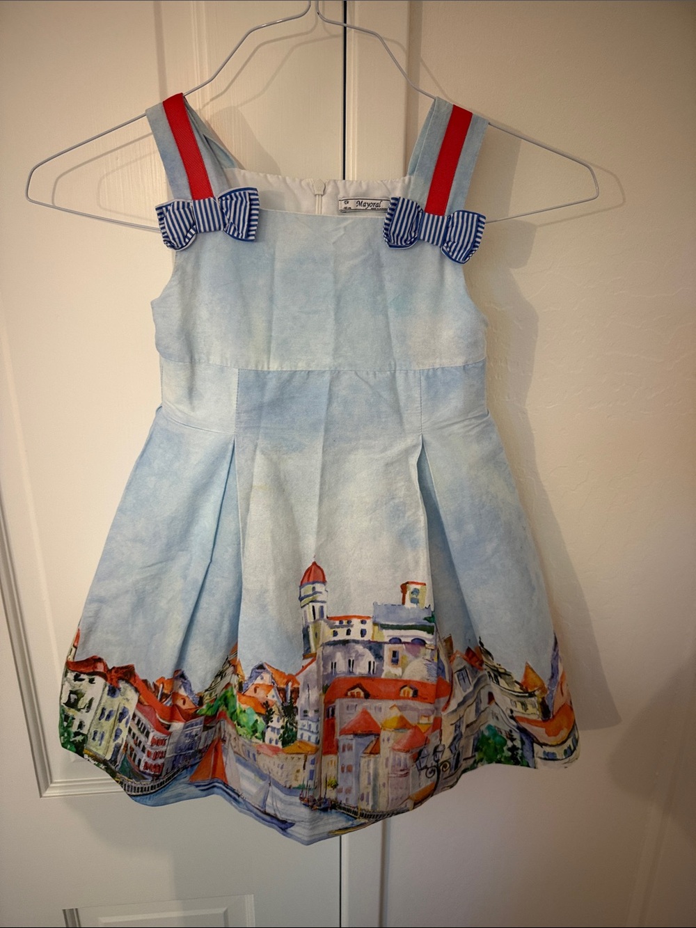 Mayoral Light Blue Dress with Scenic Border and Red Strap Accents